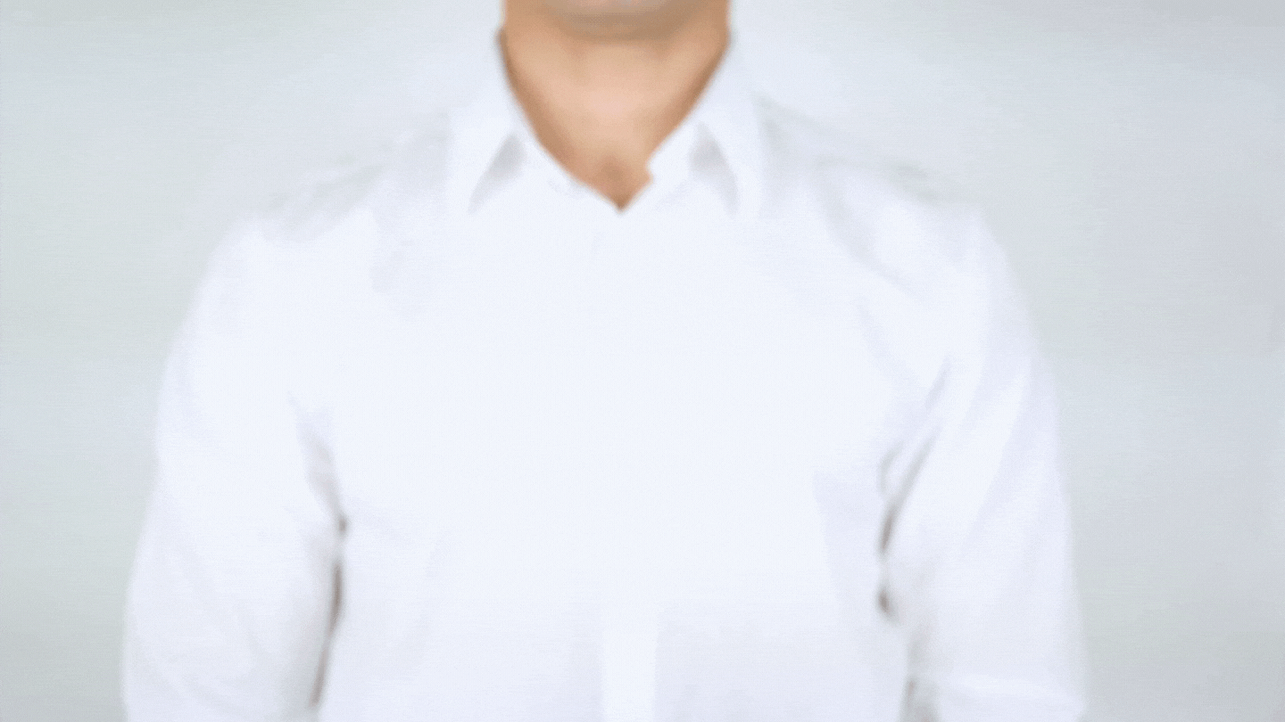 A light-skinned man in a white shirt writes "Administrative Assistant" on the screen